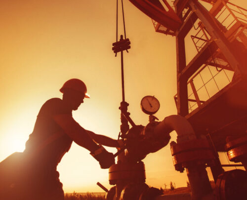 Oil,Worker,Is,Checking,The,Oil,Pump,On,The,Sunset
